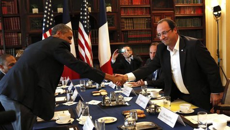U.S. President Barack Obama (L) shakes hands with French President Francois Hollande during their meeting at the G8 Summit in Enniskillen, N U.S. President Barack Obama (L) shakes hands with French President Francois Hollande during their meeting at the G8 Summit in Enniskillen, N