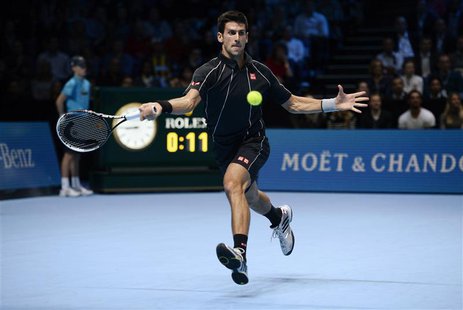Novak Djokovic of Serbia plays a shot to Rafael Nadal of Spain during their their men's final singles tennis match at the ATP World Tour Fin Novak Djokovic of Serbia plays a shot to Rafael Nadal of Spain during their their men's final singles tennis match at the ATP World Tour Fin