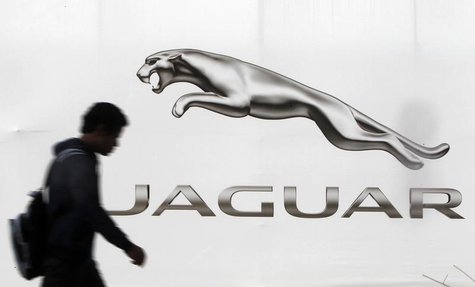 A man walks past a billboard advertising Jaguar in New Delhi February 12, 2013. REUTERS/Mansi Thapliyal A man walks past a billboard advertising Jaguar in New Delhi February 12, 2013. REUTERS/Mansi Thapliyal