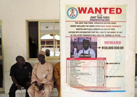 A poster advertising for the search of Boko Haram leader Abubakar Shekau is pasted on a wall in Baga village on the outskirts of Maiduguri, A poster advertising for the search of Boko Haram leader Abubakar Shekau is pasted on a wall in Baga village on the outskirts of Maiduguri,