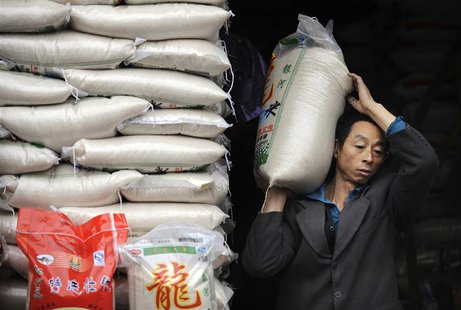 A worker transport packs of rice at a market in Hefei, Anhui province in this November 27, 2009 file photo. REUTERS/Jianan Yu/Files A worker transport packs of rice at a market in Hefei, Anhui province in this November 27, 2009 file photo. REUTERS/Jianan Yu/Files
