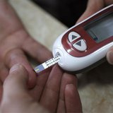 A patient takes a blood glucose test during an event aimed to help people with diabetes to cope with their illness at Saint Luka diagnostics A patient takes a blood glucose test during an event aimed to help people with diabetes to cope with their illness at Saint Luka diagnostics
