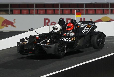 Driver Michael Schumacher (R) drives during the Race of Champions (ROC) Nations Cup at Rajamangala National Stadium in Bangkok December 15, Driver Michael Schumacher (R) drives during the Race of Champions (ROC) Nations Cup at Rajamangala National Stadium in Bangkok December 15,