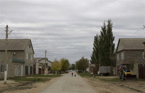Children walk in a street in Novosasitli village in the Dagestan region, September 28, 2013. Moscow now fears that hundreds of Russian-born Children walk in a street in Novosasitli village in the Dagestan region, September 28, 2013. Moscow now fears that hundreds of Russian-born