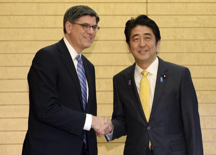 U.S. Treasury Secretary Jack Lew (L) shakes hands with Japan's Prime Minister Shinzo Abe at the start of their meeting at Abe's official res U.S. Treasury Secretary Jack Lew (L) shakes hands with Japan's Prime Minister Shinzo Abe at the start of their meeting at Abe's official res