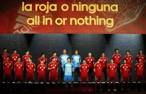 Spain's national soccer team players wearing the new Spanish kit for the upcoming 2014 World Cup stand on the stage during a presentation ce Spain's national soccer team players wearing the new Spanish kit for the upcoming 2014 World Cup stand on the stage during a presentation ce