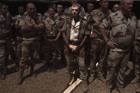 French soldiers wait for France's Defence Minister Jean-Yves Le Drian to arrive at a French military encampment at a Malian air base in Gao French soldiers wait for France's Defence Minister Jean-Yves Le Drian to arrive at a French military encampment at a Malian air base in Gao