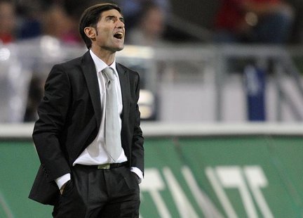 Sevilla's coach Marcelino Garcia Toral shouts during their Europa League playoff first leg soccer match against Hanover 96 in Hanover, Augus Sevilla's coach Marcelino Garcia Toral shouts during their Europa League playoff first leg soccer match against Hanover 96 in Hanover, Augus