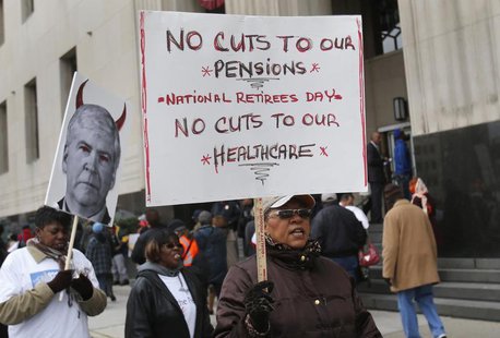 Protesters demonstrate against cuts in Detroit city workers' pensions and healthcare, outside Theodore Levin U.S. Courthouse during Detroit' Protesters demonstrate against cuts in Detroit city workers' pensions and healthcare, outside Theodore Levin U.S. Courthouse during Detroit'