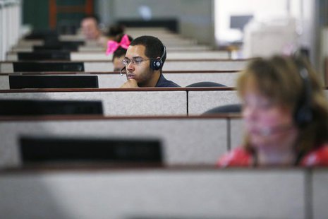 Specialists help callers and potential customers find health insurance at a customer contact and call center for HealthSource RI, Rhode Isla Specialists help callers and potential customers find health insurance at a customer contact and call center for HealthSource RI, Rhode Isla