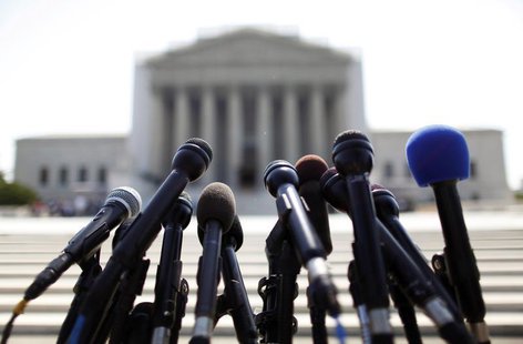 News microphones wait to capture reactions from U.S. Supreme Court rulings outside the court building in Washington, June 25, 2013. REUTERS/ News microphones wait to capture reactions from U.S. Supreme Court rulings outside the court building in Washington, June 25, 2013. REUTERS/