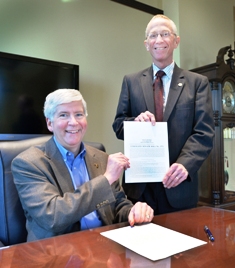Michigan Governor Rick Snyder and State Senator Bruce Caswell at signing of Senate Bill 372 Michigan Governor Rick Snyder and State Senator Bruce Caswell at signing of Senate Bill 372