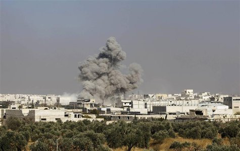 Smoke rises from what activists say was shelling from forces loyal to Syrian President Bashar al-Assad in Aleppo, November 14, 2013. REUTERS Smoke rises from what activists say was shelling from forces loyal to Syrian President Bashar al-Assad in Aleppo, November 14, 2013. REUTERS