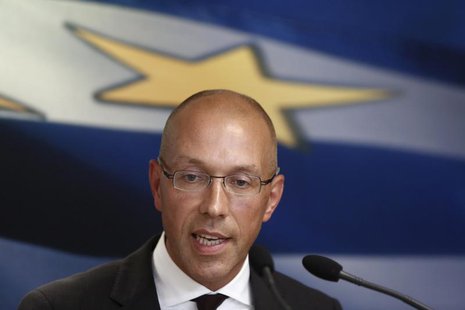 European Central Bank (ECB) executive board member Joerg Asmussen addresses reporters during a news conference after his meeting with Greece European Central Bank (ECB) executive board member Joerg Asmussen addresses reporters during a news conference after his meeting with Greece