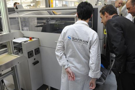 France's President and UMP party candidate for the 2012 French presidential elections Nicolas Sarkozy (R) visits the Safran Sagem defence se France's President and UMP party candidate for the 2012 French presidential elections Nicolas Sarkozy (R) visits the Safran Sagem defence se