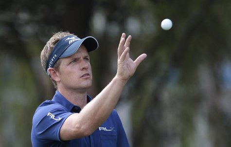 Luke Donald of Britain gets his ball back from his caddy on the fifth hole during the second round of the WGC-HSBC Champions golf tournament Luke Donald of Britain gets his ball back from his caddy on the fifth hole during the second round of the WGC-HSBC Champions golf tournament