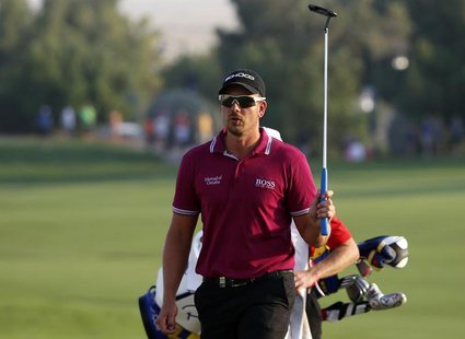 Henrik Stenson of Sweden swings his club as he arrives on the 18th hole during the second round of the DP World Tour Championship golf tourn Henrik Stenson of Sweden swings his club as he arrives on the 18th hole during the second round of the DP World Tour Championship golf tourn