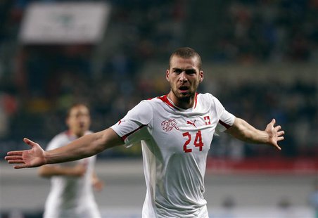 Switzerland's Pajtim Kasami (C) celebrates after scoring a goal against South Korea during their friendly soccer match at the Seoul World Cu Switzerland's Pajtim Kasami (C) celebrates after scoring a goal against South Korea during their friendly soccer match at the Seoul World Cu