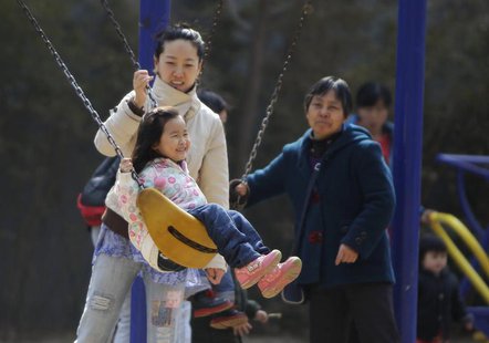 A mother pushes her daughter on a swing in Beijing April 3, 2013. REUTERS/Jason Lee A mother pushes her daughter on a swing in Beijing April 3, 2013. REUTERS/Jason Lee