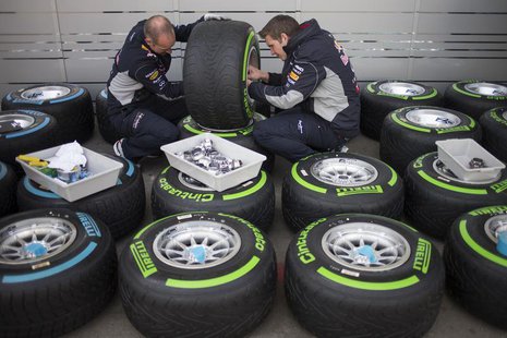 Red Bull Formula One team members check tires at the Circuit of the Americas in Austin, Texas November 14, 2013. The U.S. Grand Prix will ta Red Bull Formula One team members check tires at the Circuit of the Americas in Austin, Texas November 14, 2013. The U.S. Grand Prix will ta