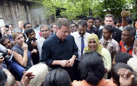 Britain's Prime Minister David Cameron talks with Tamil people at the Sabapathi Pillay Welfare Centre in Jaffna, about 400 km (250 miles) no Britain's Prime Minister David Cameron talks with Tamil people at the Sabapathi Pillay Welfare Centre in Jaffna, about 400 km (250 miles) no