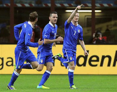 Italy's Ignazio Abate (R) celebrates after scoring against Germany during their international friendly soccer match at the San Siro Stadium Italy's Ignazio Abate (R) celebrates after scoring against Germany during their international friendly soccer match at the San Siro Stadium