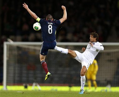 Scotland's Scott Brown (L) is tackled by Jermaine Jones of the U.S. during their international friendly soccer match at Hampden Park Stadium Scotland's Scott Brown (L) is tackled by Jermaine Jones of the U.S. during their international friendly soccer match at Hampden Park Stadium