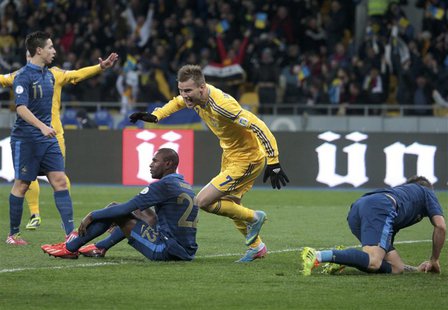 Ukraine's Andriy Yarmolenko (2nd R) celebrates a goal scored by his team mate Roman Zozulya (not pictured) during their 2014 World Cup quali Ukraine's Andriy Yarmolenko (2nd R) celebrates a goal scored by his team mate Roman Zozulya (not pictured) during their 2014 World Cup quali