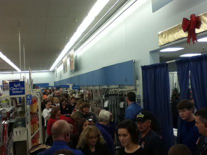This is just the front of the line to meet Sarah Palin at Walmart in Rib Mountain 11/14/13. From the back corner, the line goes left to the front of the store, and weaves through several departments. This is just the front of the line to meet Sarah Palin at Walmart in Rib Mountain 11/14/13. From the back corner, the line goes left to the front of the store, and weaves through several departments.