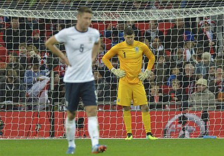 England's goalkeeper Fraser Forster looks down after a goal by Chile's Alexis Sanchez during their international friendly soccer match at We England's goalkeeper Fraser Forster looks down after a goal by Chile's Alexis Sanchez during their international friendly soccer match at We