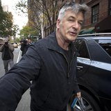 Actor Alec Baldwin shoves a photographer and tells him to move out of his way after he arrived in his SUV at the building where he lives in Actor Alec Baldwin shoves a photographer and tells him to move out of his way after he arrived in his SUV at the building where he lives in