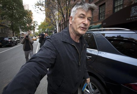 Actor Alec Baldwin shoves a photographer and tells him to move out of his way after he arrived in his SUV at the building where he lives in Actor Alec Baldwin shoves a photographer and tells him to move out of his way after he arrived in his SUV at the building where he lives in