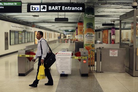 A man turns away at the Powell Street station after learning of a strike by employees of the Bay Area Rapid Transit (BART) in San Francisco, A man turns away at the Powell Street station after learning of a strike by employees of the Bay Area Rapid Transit (BART) in San Francisco,