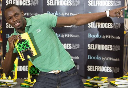 Jamaican athlete Usain Bolt poses for photographers with a copy of his autobiography, "Faster than Lightning," at Selfridges in central Lond Jamaican athlete Usain Bolt poses for photographers with a copy of his autobiography, "Faster than Lightning," at Selfridges in central Lond