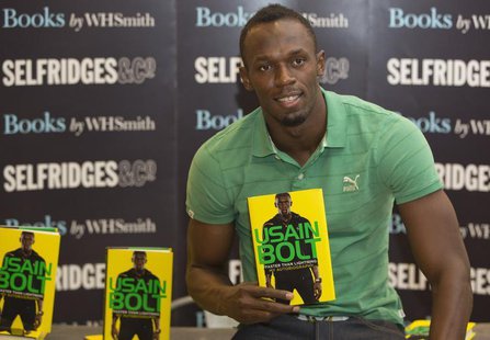 Jamaican athlete Usain Bolt poses for photographers with a copy of his autobiography, "Faster than Lightning," at Selfridges in central Lond Jamaican athlete Usain Bolt poses for photographers with a copy of his autobiography, "Faster than Lightning," at Selfridges in central Lond