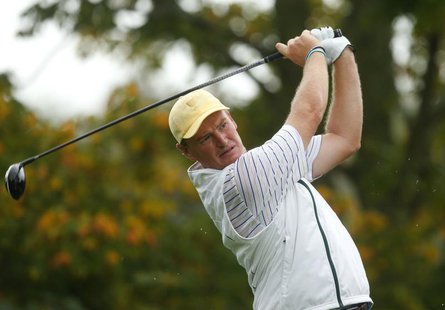 International team member Ernie Els of South Africa hits off the fifth tee as he plays with teammate Brendon de Jonge of Zimbabwe against th International team member Ernie Els of South Africa hits off the fifth tee as he plays with teammate Brendon de Jonge of Zimbabwe against th