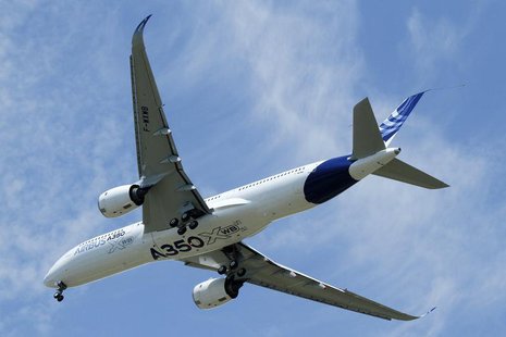 The new Airbus A350 flies over Toulouse-Blagnac airport during its maiden flight in southwestern France, June 14, 2013. REUTERS/Jean-Philipp The new Airbus A350 flies over Toulouse-Blagnac airport during its maiden flight in southwestern France, June 14, 2013. REUTERS/Jean-Philipp