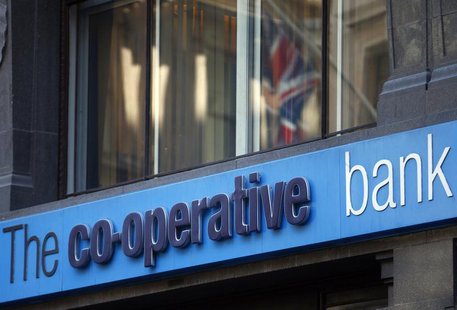 A Union Jack is reflected in a window of a branch of the Co-operative Bank in the City of London November 4, 2013. REUTERS/Andrew Winning A Union Jack is reflected in a window of a branch of the Co-operative Bank in the City of London November 4, 2013. REUTERS/Andrew Winning