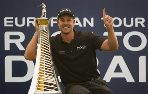 Henrik Stenson of Sweden poses with his 2013 Race to Dubai trophy after winning the DP World Tour Championship in Dubai November 17, 2013. W Henrik Stenson of Sweden poses with his 2013 Race to Dubai trophy after winning the DP World Tour Championship in Dubai November 17, 2013. W