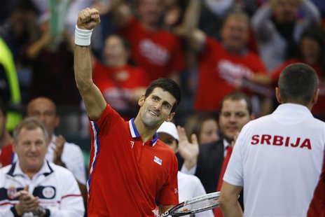 Serbia's Novak Djokovic celebrates winning a set against Czech Republic's Tomas Berdych during their Davis Cup World Group final tennis matc Serbia's Novak Djokovic celebrates winning a set against Czech Republic's Tomas Berdych during their Davis Cup World Group final tennis matc