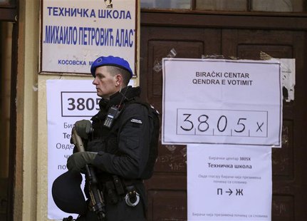 A European Union policeman secures a polling station in the northern part of the ethnically-divided town of Mitrovica November 17, 2013, NAT A European Union policeman secures a polling station in the northern part of the ethnically-divided town of Mitrovica November 17, 2013, NAT