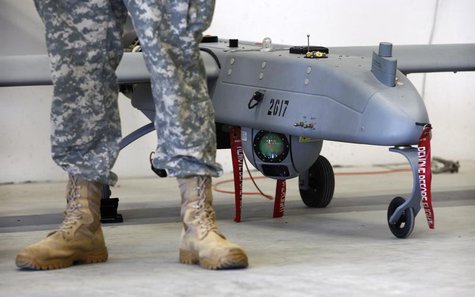 A soldier stands in front of a 'Shadow' Unmanned Aerial System during an official presentation by the German and U.S. Unmanned Aerial System A soldier stands in front of a 'Shadow' Unmanned Aerial System during an official presentation by the German and U.S. Unmanned Aerial System
