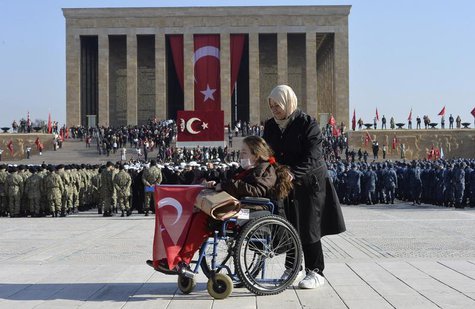 A woman holds the Turkish national flag at the mausoleum of Mustafa Kemal Ataturk, the first president of Turkey and founder of the modern s A woman holds the Turkish national flag at the mausoleum of Mustafa Kemal Ataturk, the first president of Turkey and founder of the modern s