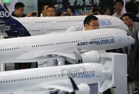 A visitor looks at a miniature Airbus A350-900 passenger aircraft at Aviation Expo China 2013 in Beijing September 25, 2013. REUTERS/Kim Kyu A visitor looks at a miniature Airbus A350-900 passenger aircraft at Aviation Expo China 2013 in Beijing September 25, 2013. REUTERS/Kim Kyu