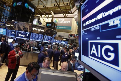 The American International Group, Inc. (AIG) stock ticker is seen on a monitor as traders work on the floor of the New York Stock Exchange a The American International Group, Inc. (AIG) stock ticker is seen on a monitor as traders work on the floor of the New York Stock Exchange a