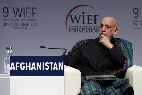 Afghanistan's President Hamid Karzai listens to an address during the World Islamic Economic Forum in London October 29, 2013. REUTERS/Luke Afghanistan's President Hamid Karzai listens to an address during the World Islamic Economic Forum in London October 29, 2013. REUTERS/Luke