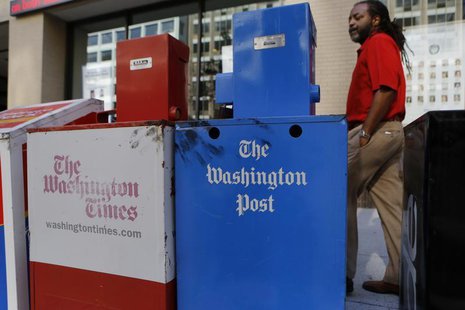 Washington Post (R) and Washington Times newspaper boxes are pictured outside the entrance to the Washington Post headquarters in Washington Washington Post (R) and Washington Times newspaper boxes are pictured outside the entrance to the Washington Post headquarters in Washington