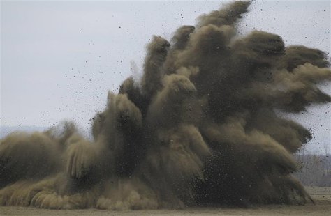 Munitions (L) are destroyed in a controlled blast at the U.S. Army Letterkenny Munitions Center in Chambersburg, Pennsylvania November 19, 2 Munitions (L) are destroyed in a controlled blast at the U.S. Army Letterkenny Munitions Center in Chambersburg, Pennsylvania November 19, 2