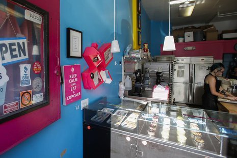 An employee creates cupcakes at Cups And Cakes Bakery, a bakery that accepts Bitcoin, a new digital currency, as a form of payment in San Fr An employee creates cupcakes at Cups And Cakes Bakery, a bakery that accepts Bitcoin, a new digital currency, as a form of payment in San Fr