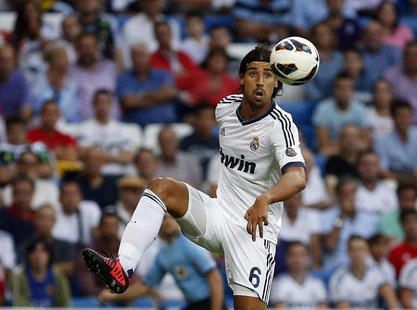 Real Madrid's Sami Khedira controls the ball during their Spanish first division soccer match against Granada at the Santiago Bernabeu stadi Real Madrid's Sami Khedira controls the ball during their Spanish first division soccer match against Granada at the Santiago Bernabeu stadi